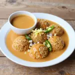 Nationalgericht Ghana: Rice Balls with Groundnut Soup (Rezept) Nationalgericht Ghana: Rice Balls with Groundnut Soup (Rezept)